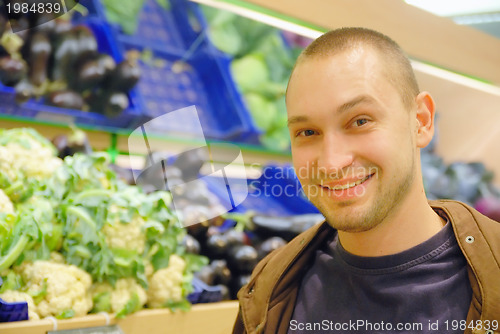 Image of smiling man in supermarket