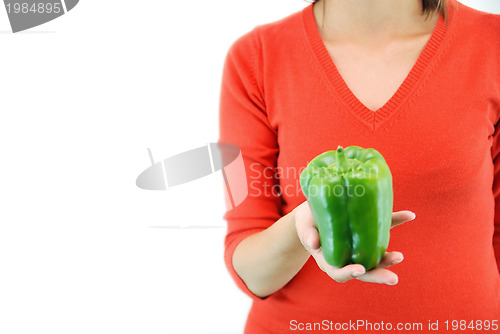 Image of green pepper in woman hand