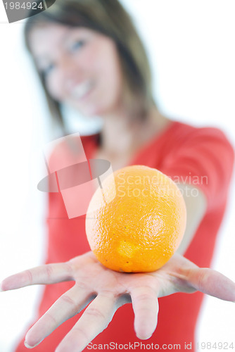 Image of happy girl with orange in hand