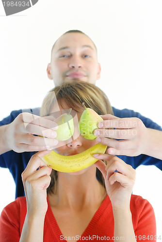 Image of happy and healthy couple with fruits