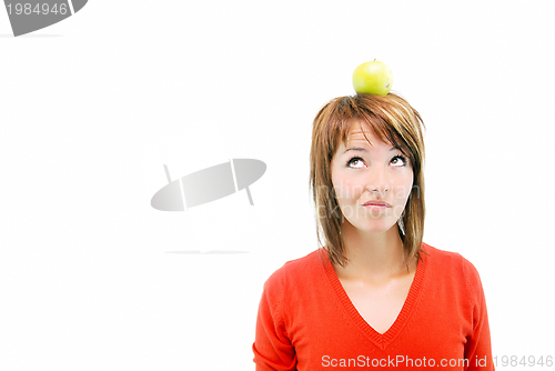 Image of pretty girl with apple on head