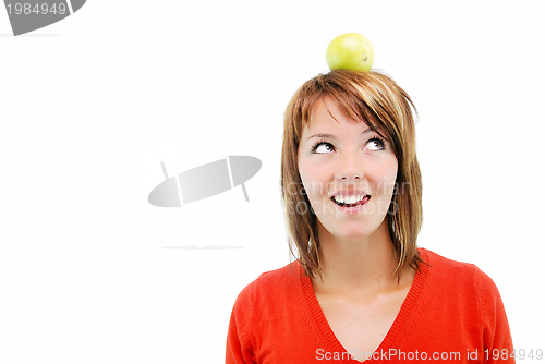 Image of pretty girl with apple on head