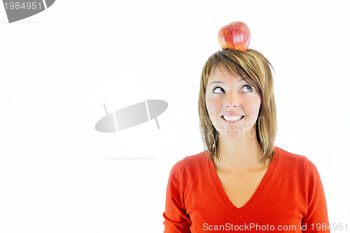 Image of pretty girl with apple on head