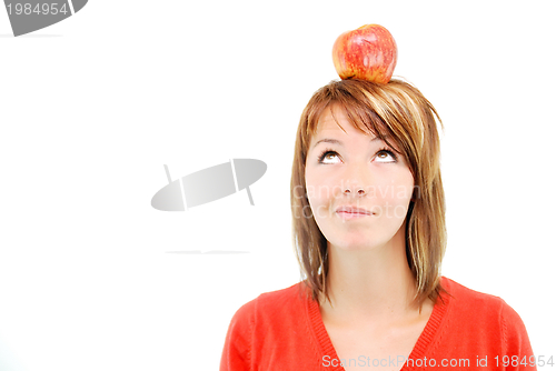 Image of pretty girl with apple on head