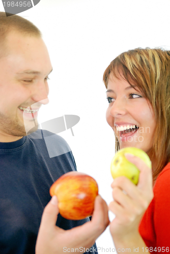 Image of healthy couple with apple