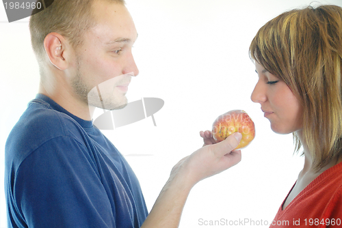 Image of healthy couple with apple