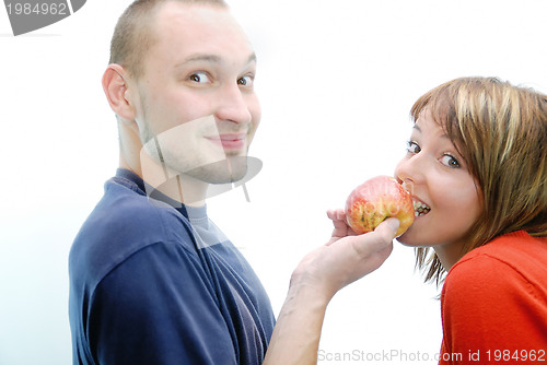 Image of healthy couple with apple