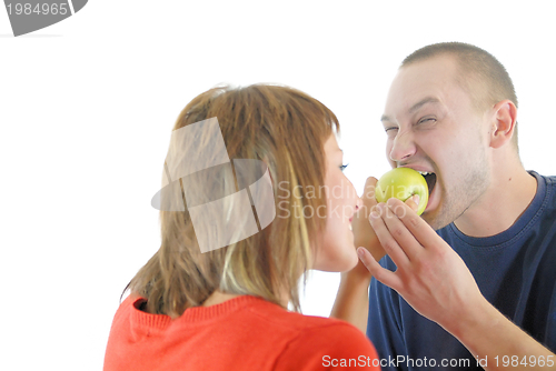 Image of healthy couple with apple