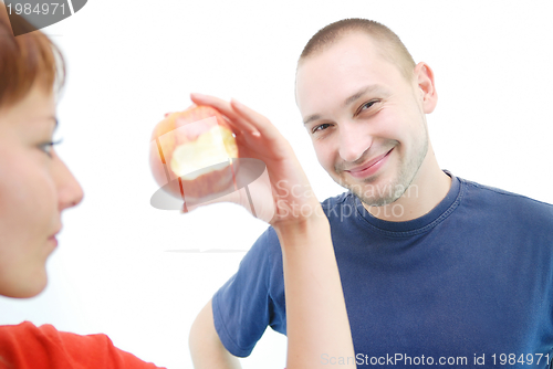 Image of healthy couple with apple