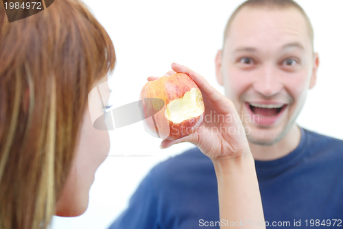 Image of healthy couple with apple