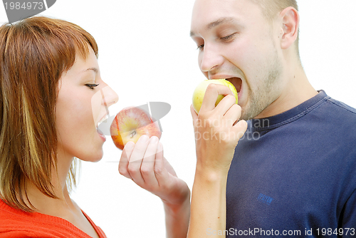 Image of healthy couple with apple