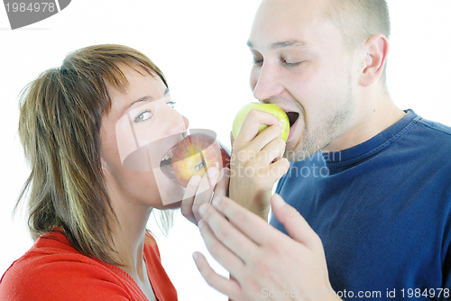 Image of healthy couple with apple