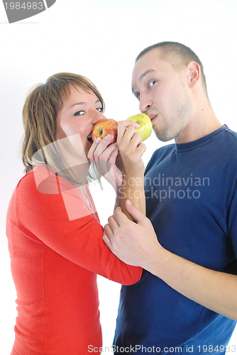 Image of happy couple eating apples