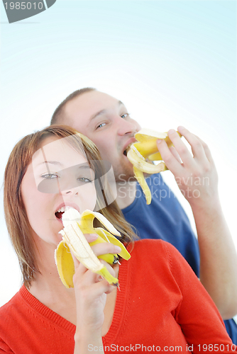 Image of happy couple with bananas