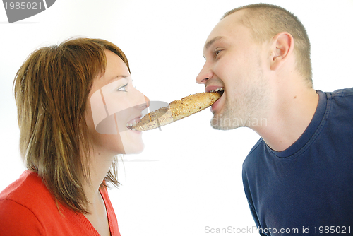 Image of happy couple eating croissant