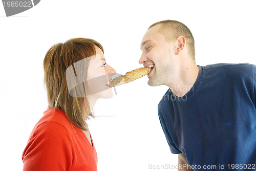 Image of happy couple eating croissant