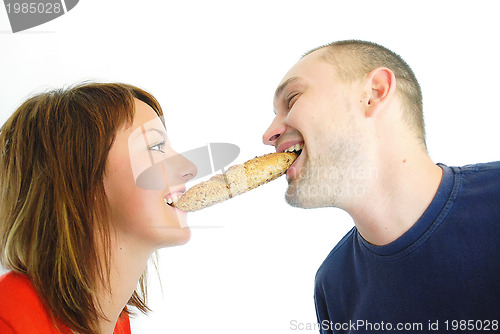 Image of happy couple eating croissant