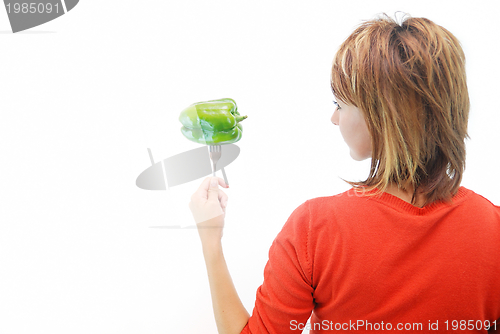 Image of pretty girl with pepper isolated