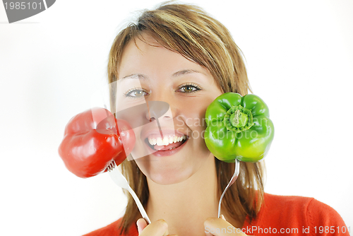 Image of pretty girl with pepper isolated