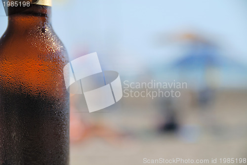 Image of cold beer on beach