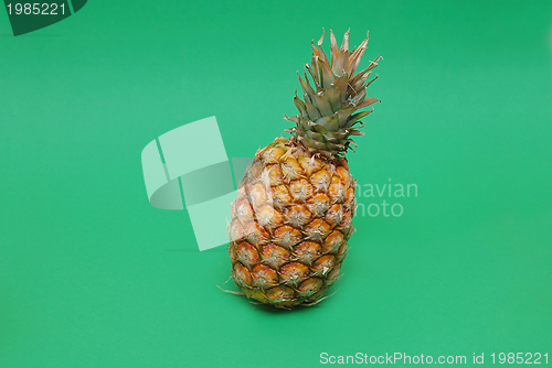 Image of ananas on green background