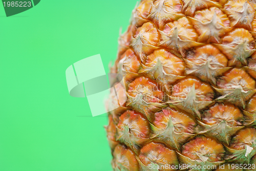 Image of ananas on green background