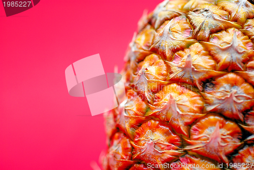 Image of ananas on red background