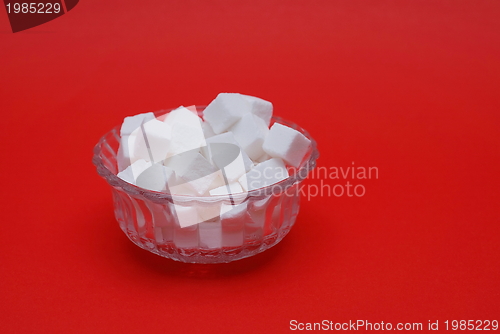 Image of sugar on red background