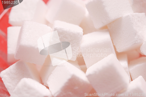 Image of sugar on red background