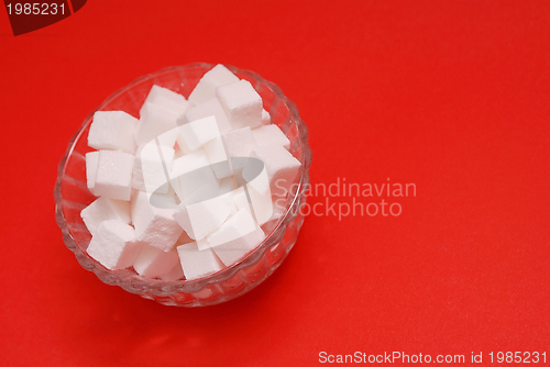 Image of sugar on red background