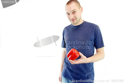 Image of happy couple holding peppers with head