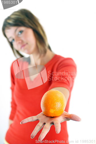 Image of happy girl with orange in hand