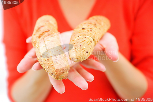 Image of fresh croissant in woman hand
