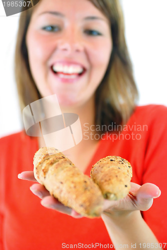 Image of fresh croissant in woman hand