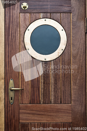 Image of Old ship door with a window