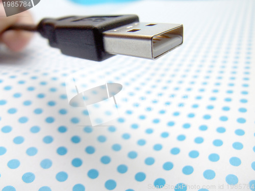 Image of usb cable on dotted background