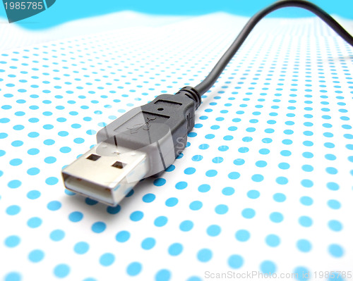 Image of usb cable on dotted background