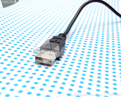 Image of usb cable on dotted background