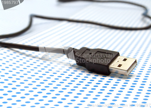 Image of usb cable on dotted background