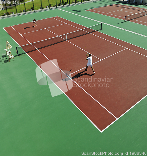 Image of happy young couple play tennis game outdoor