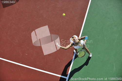 Image of young woman play tennis outdoor