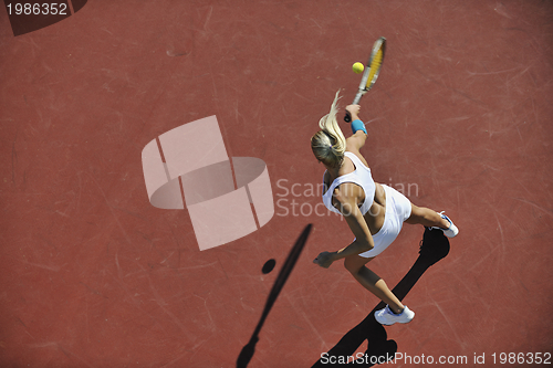 Image of young woman play tennis outdoor