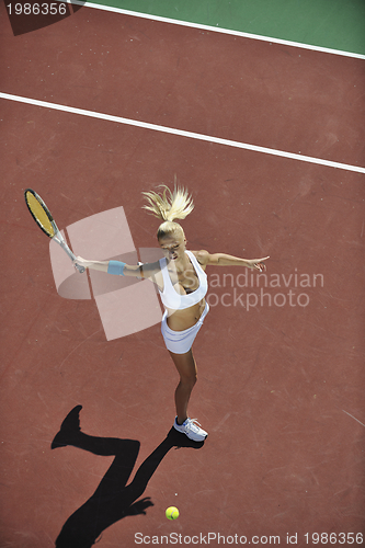 Image of young woman play tennis outdoor