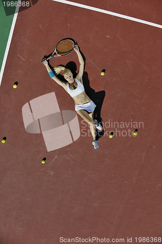 Image of young woman play tennis outdoor