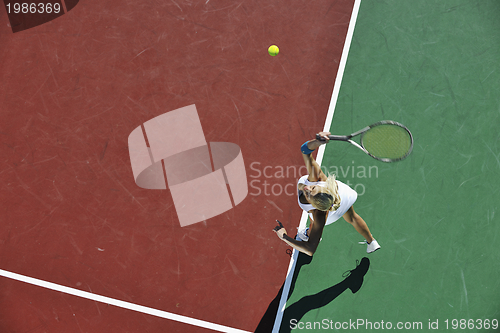 Image of young woman play tennis outdoor
