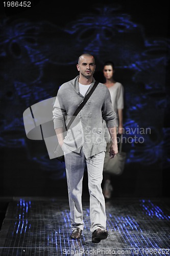 Image of male model on fashion show