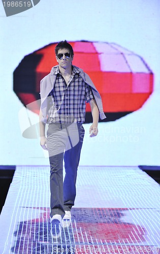 Image of male model on fashion show