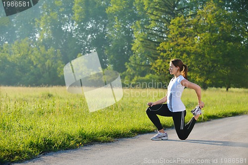 Image of woman stretching before fitness