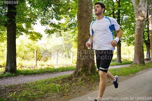 Image of Young couple jogging at morning