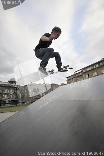 Image of Boy practicing skate in a skate park